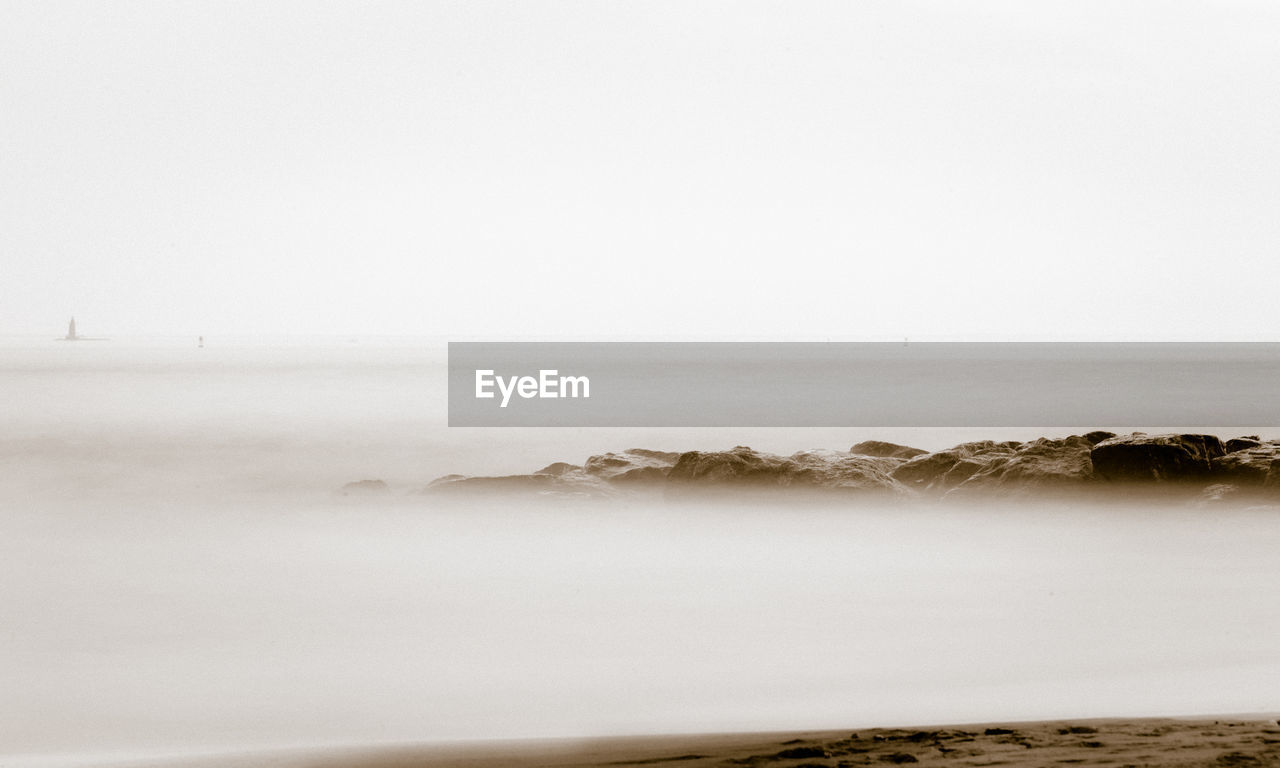 Scenic view of sea against clear sky