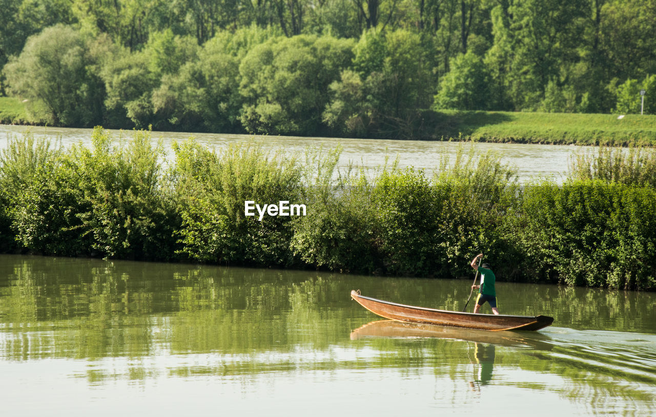 SCENIC VIEW OF LAKE BY TREES