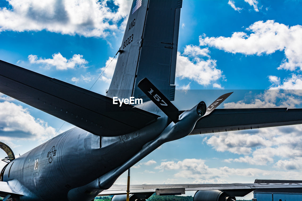 LOW ANGLE VIEW OF AIRPLANE FLYING IN SKY