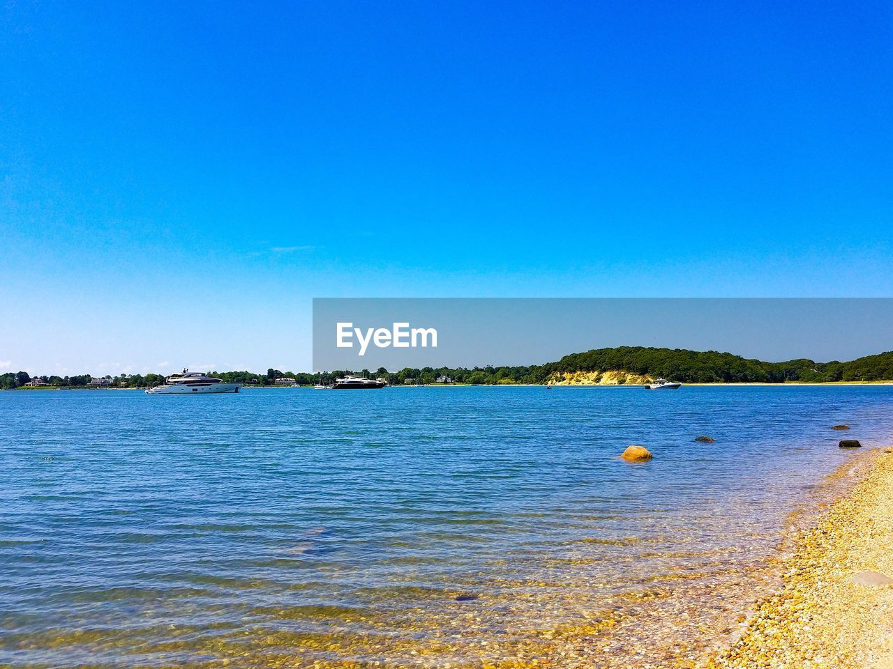 SCENIC VIEW OF SEA AGAINST BLUE SKY