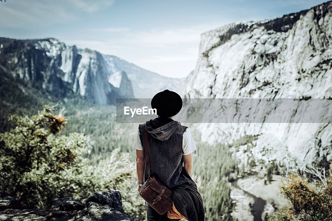 Rear view of hiker standing at yosemite national park