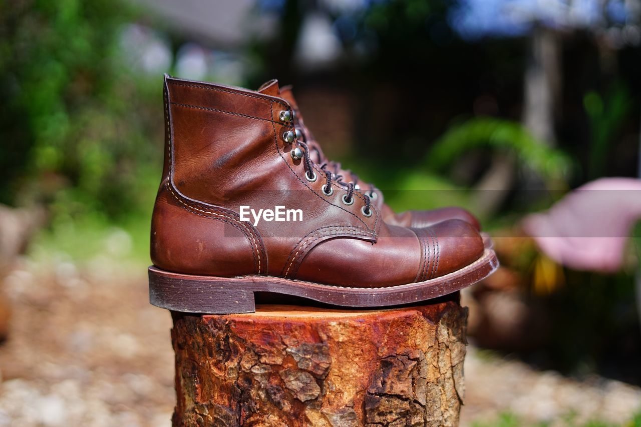 CLOSE-UP OF SHOES ON OLD METAL