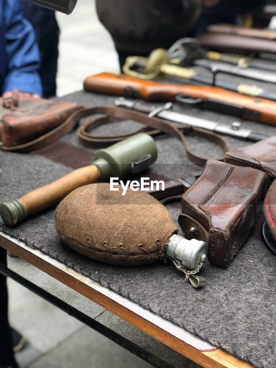 High angle view of weapons for sale on table outdoors