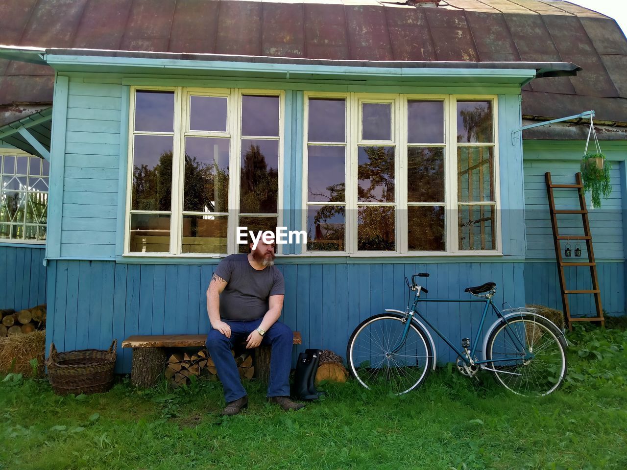 Full length of man sitting on bicycle