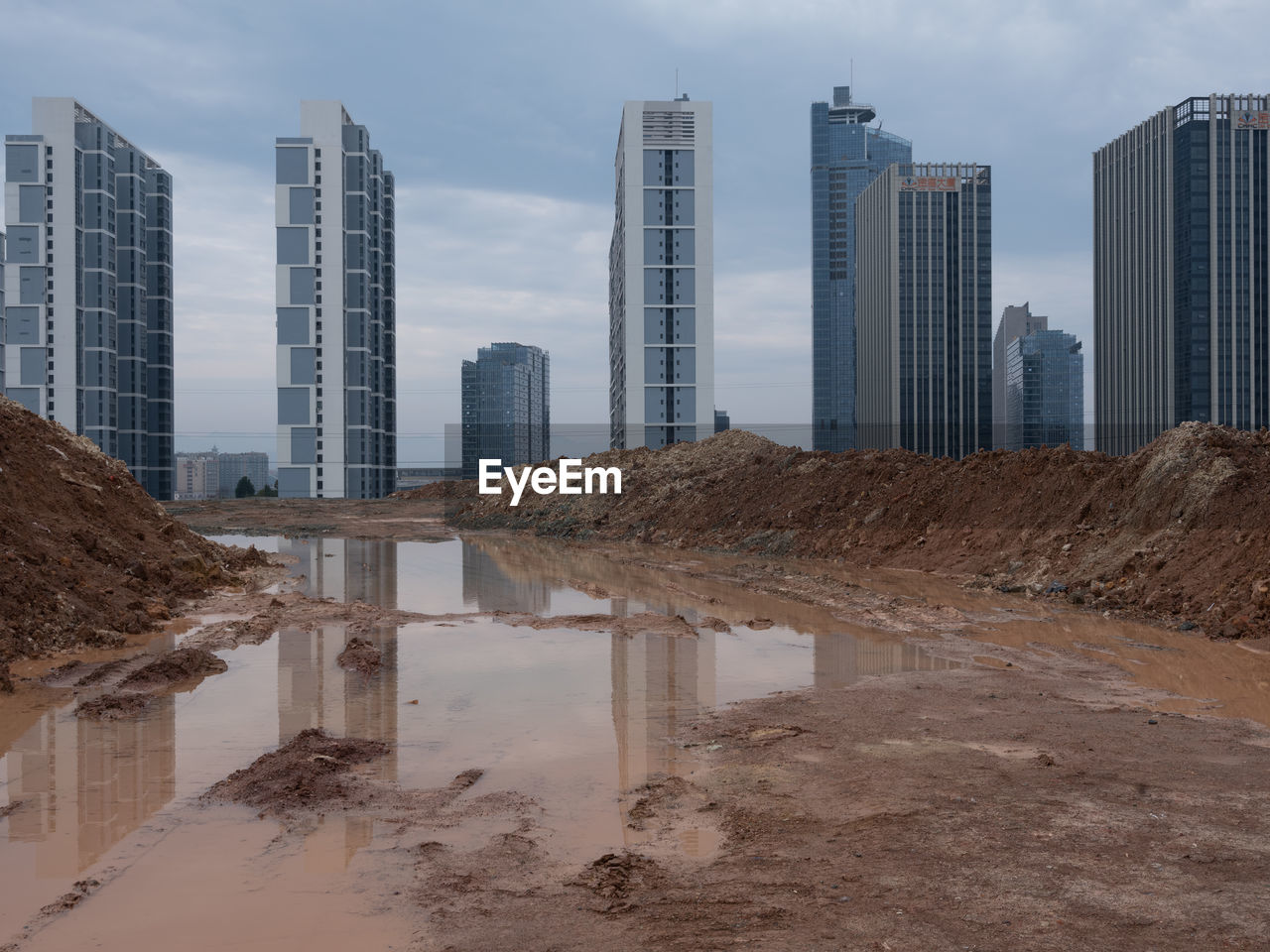 Buildings in city against sky