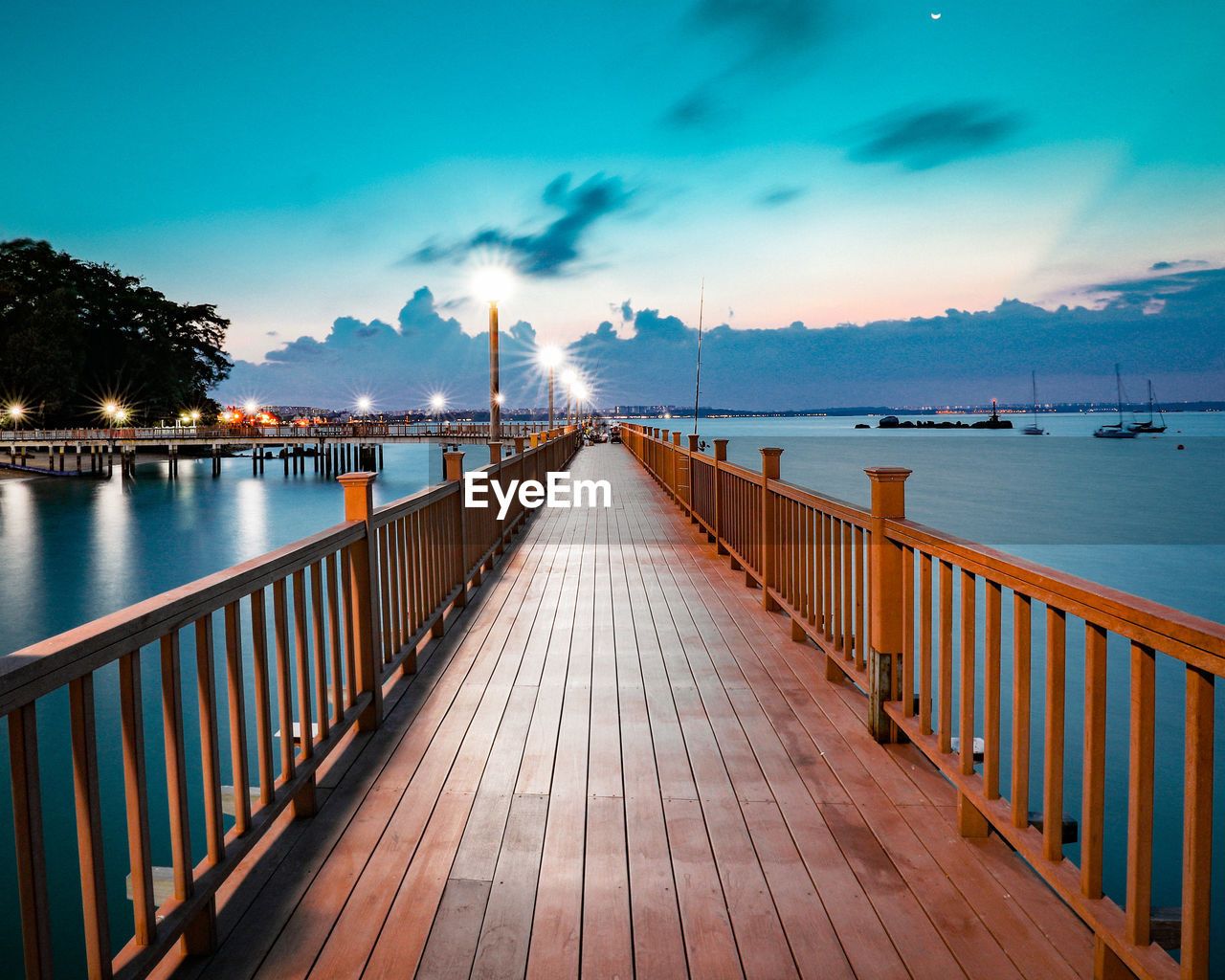 Pier over sea against sky