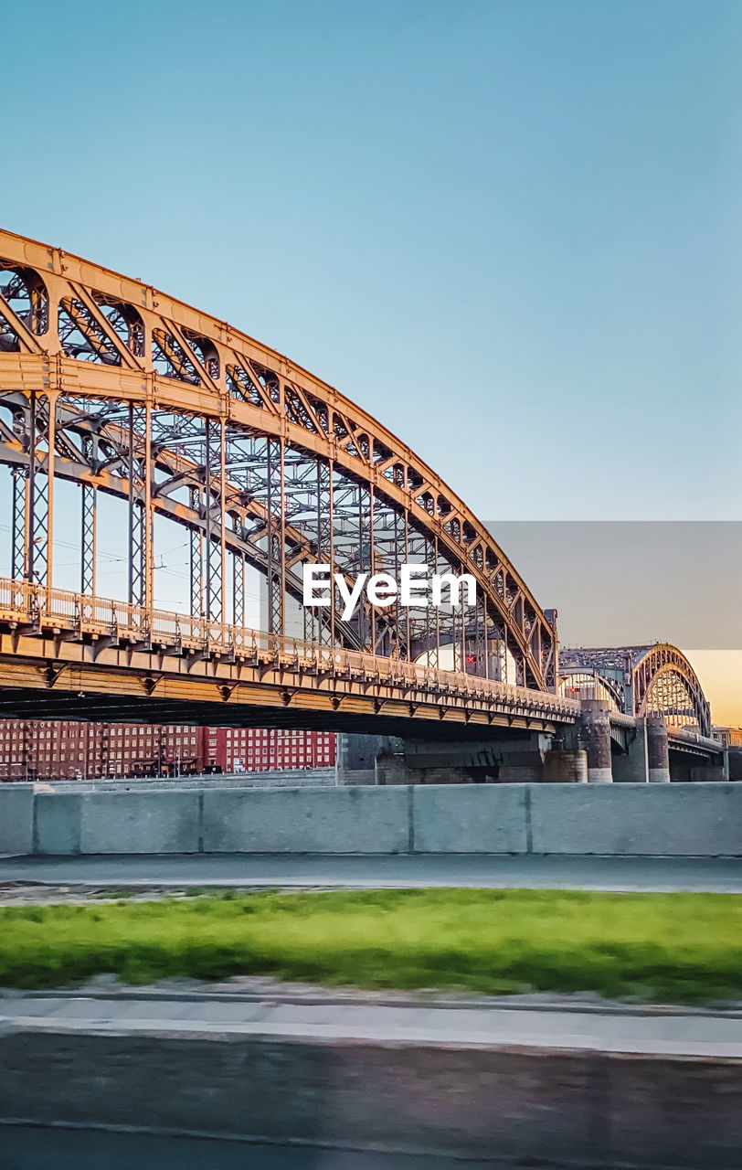 View of bridge over river against clear sky