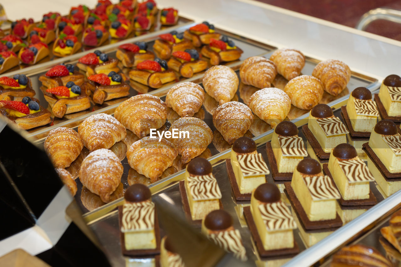 Fruit pastries with strawberries and black cherries.