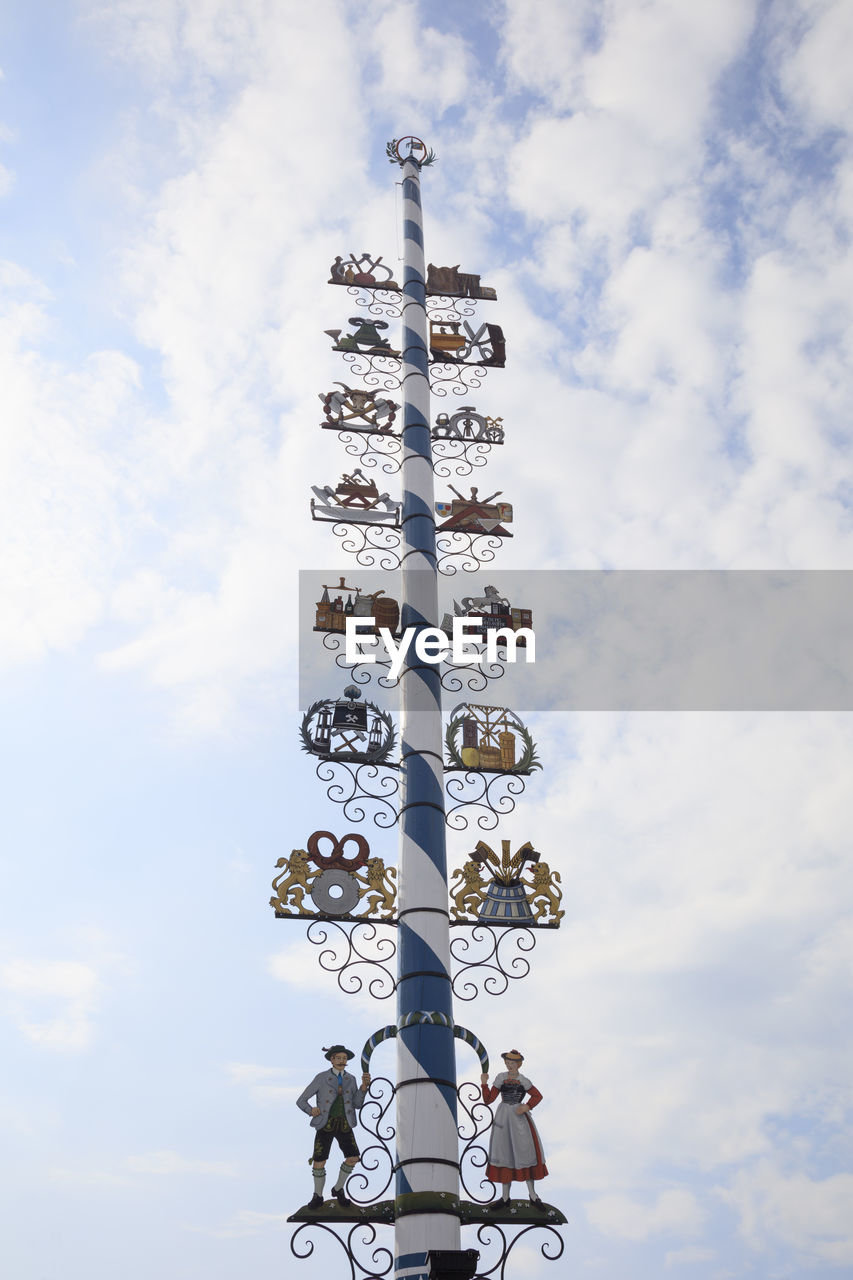 Tall maypole standing against sky