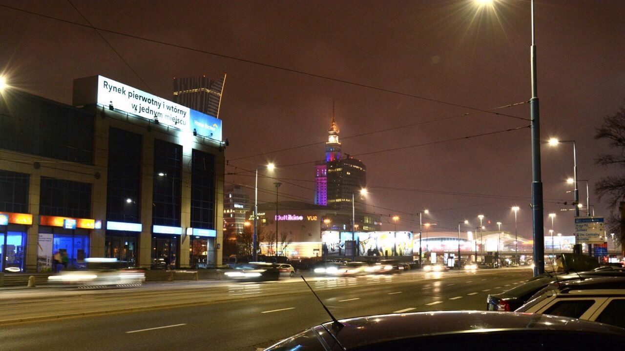 VIEW OF CITY STREET AT NIGHT