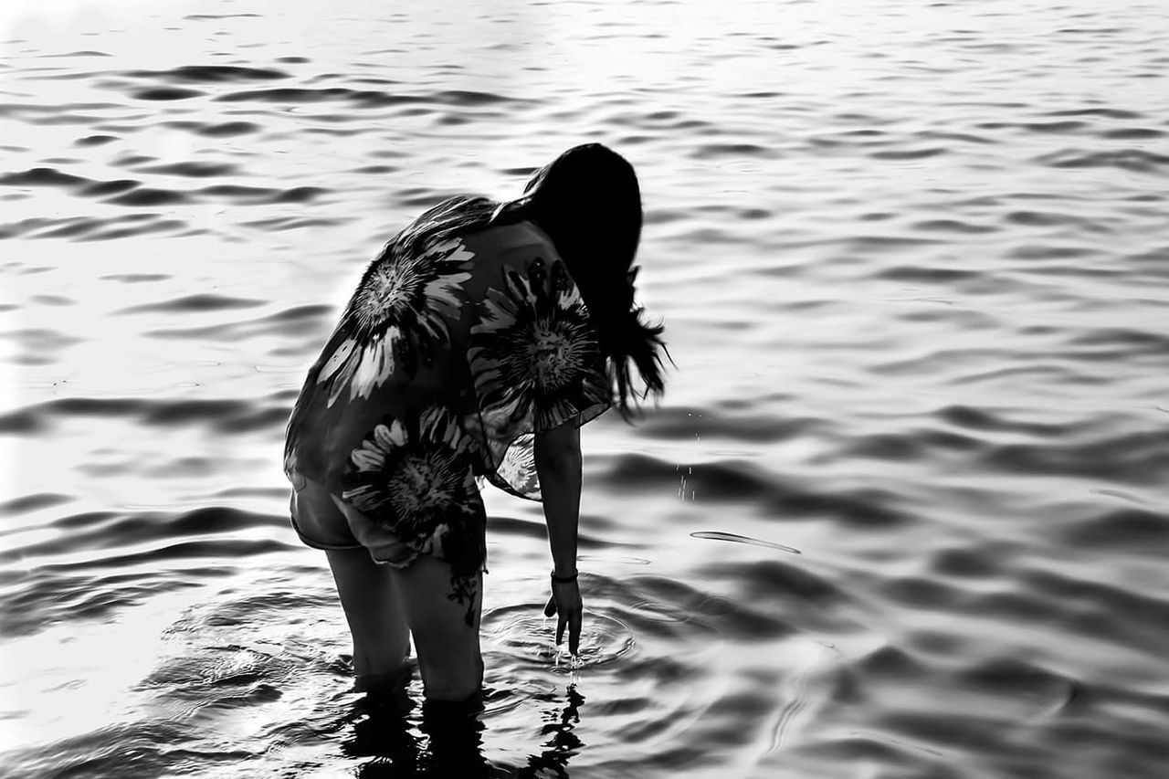 PERSON SWIMMING IN LAKE