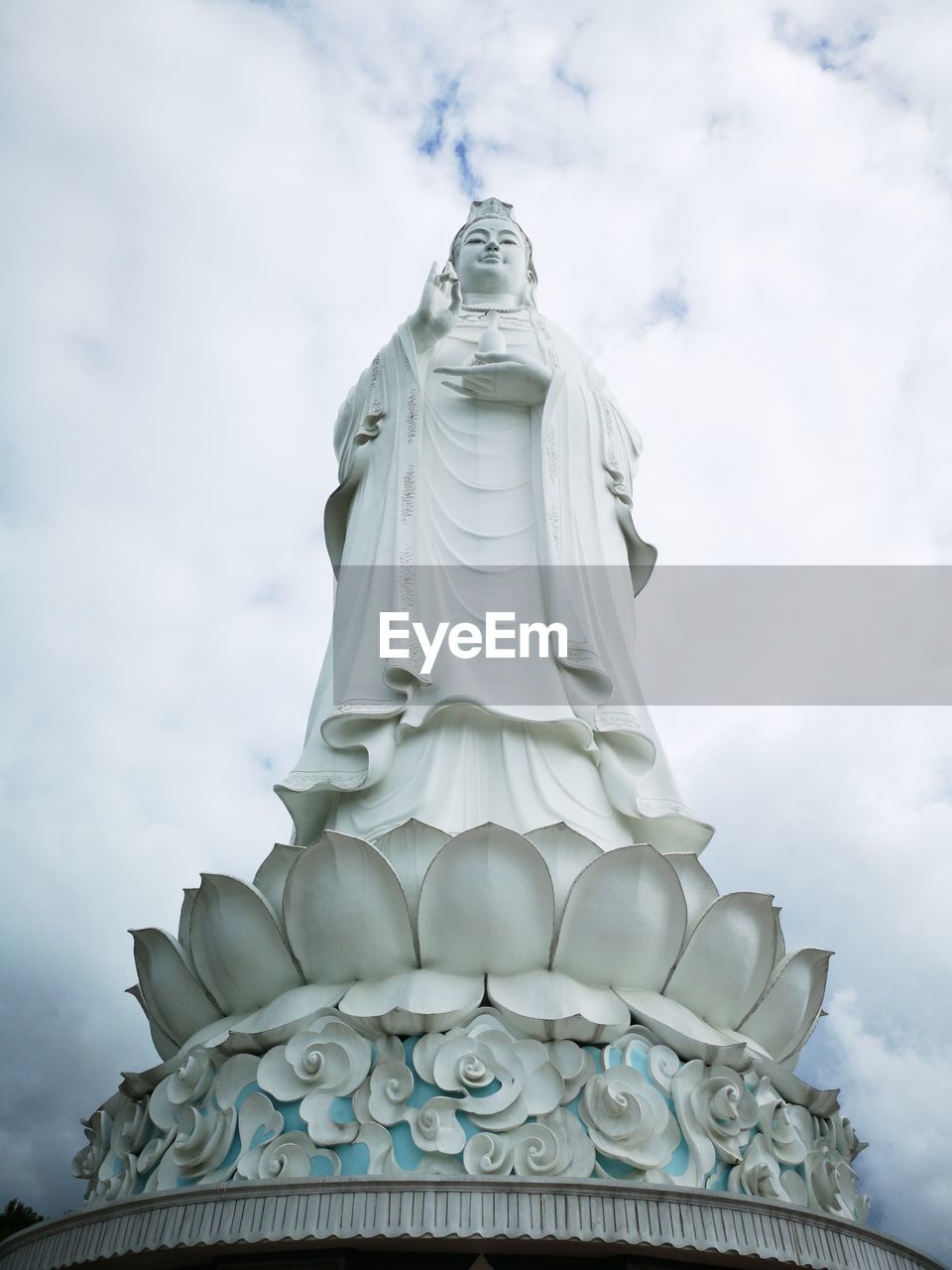 Low angle view of statue against sky