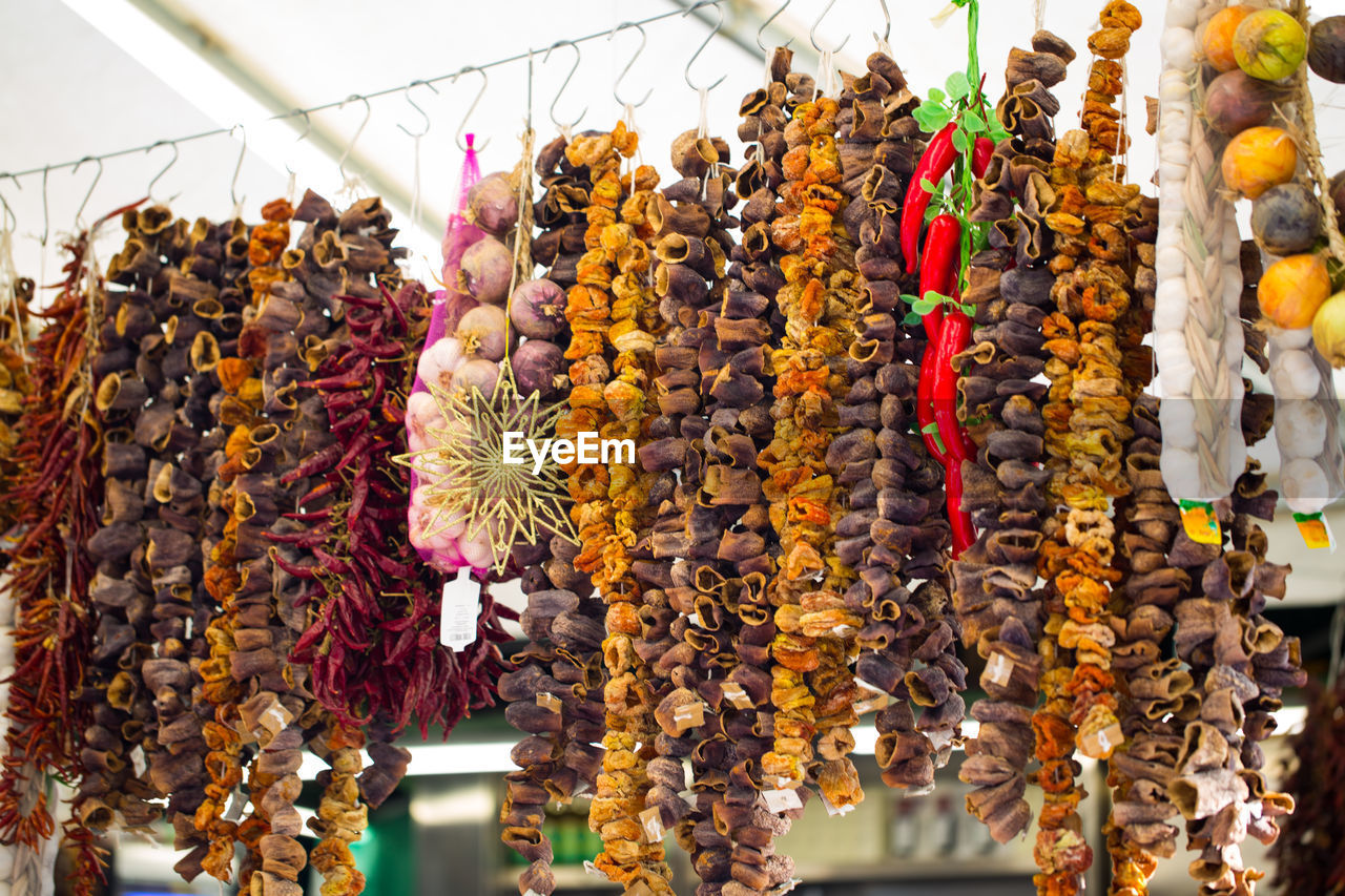 VARIOUS FLOWERS HANGING ON MARKET FOR SALE