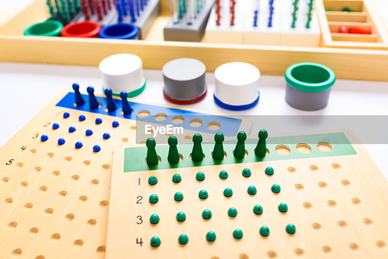 high angle view of multi colored toy blocks on white background