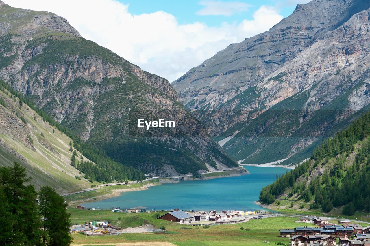 Panoramic view of lake and buildings against sky