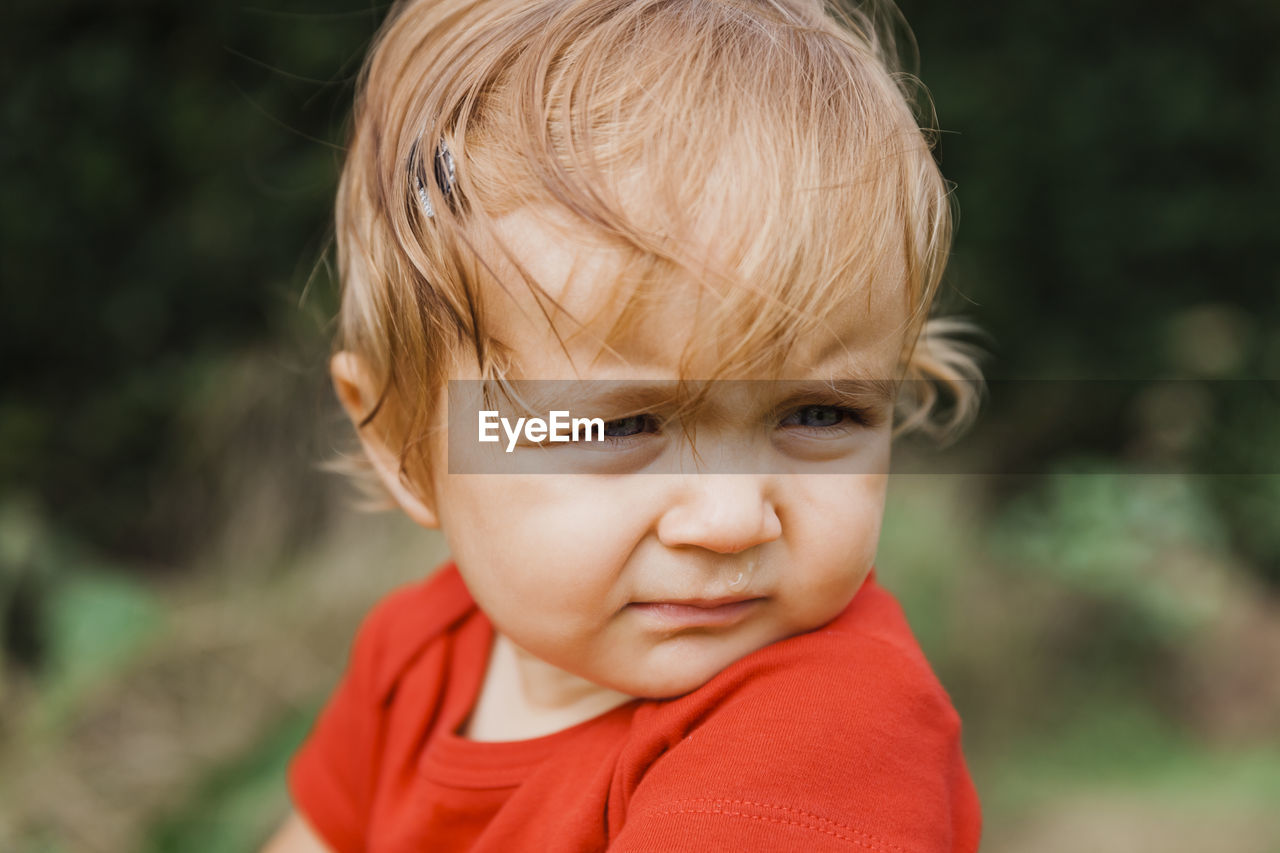 Close-up of cute boy looking away