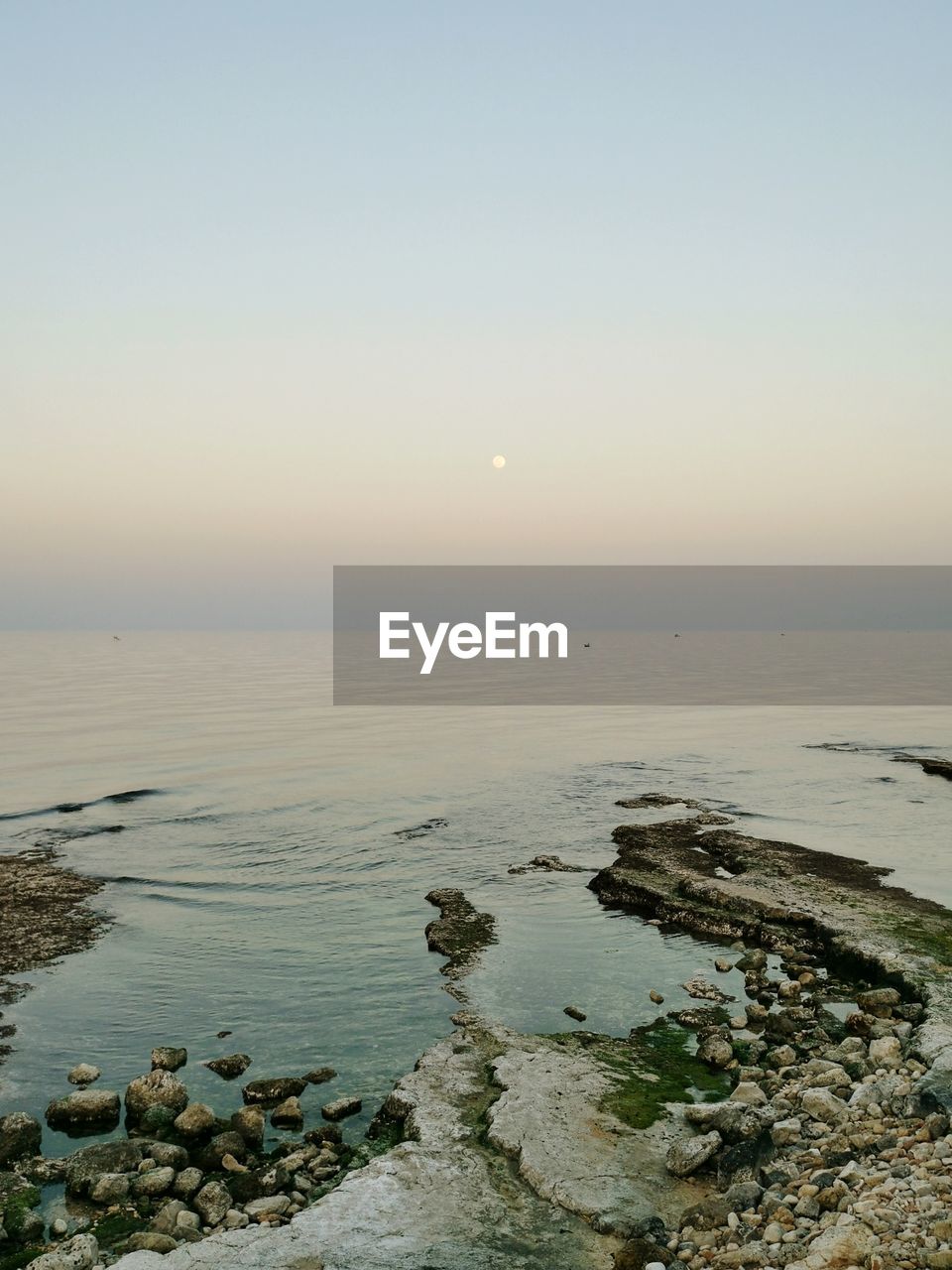 SCENIC VIEW OF SEA DURING SUNSET