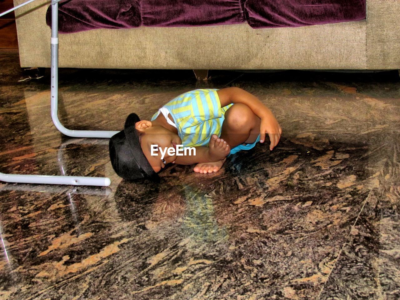 HIGH ANGLE VIEW PORTRAIT OF BOY LYING ON MAN