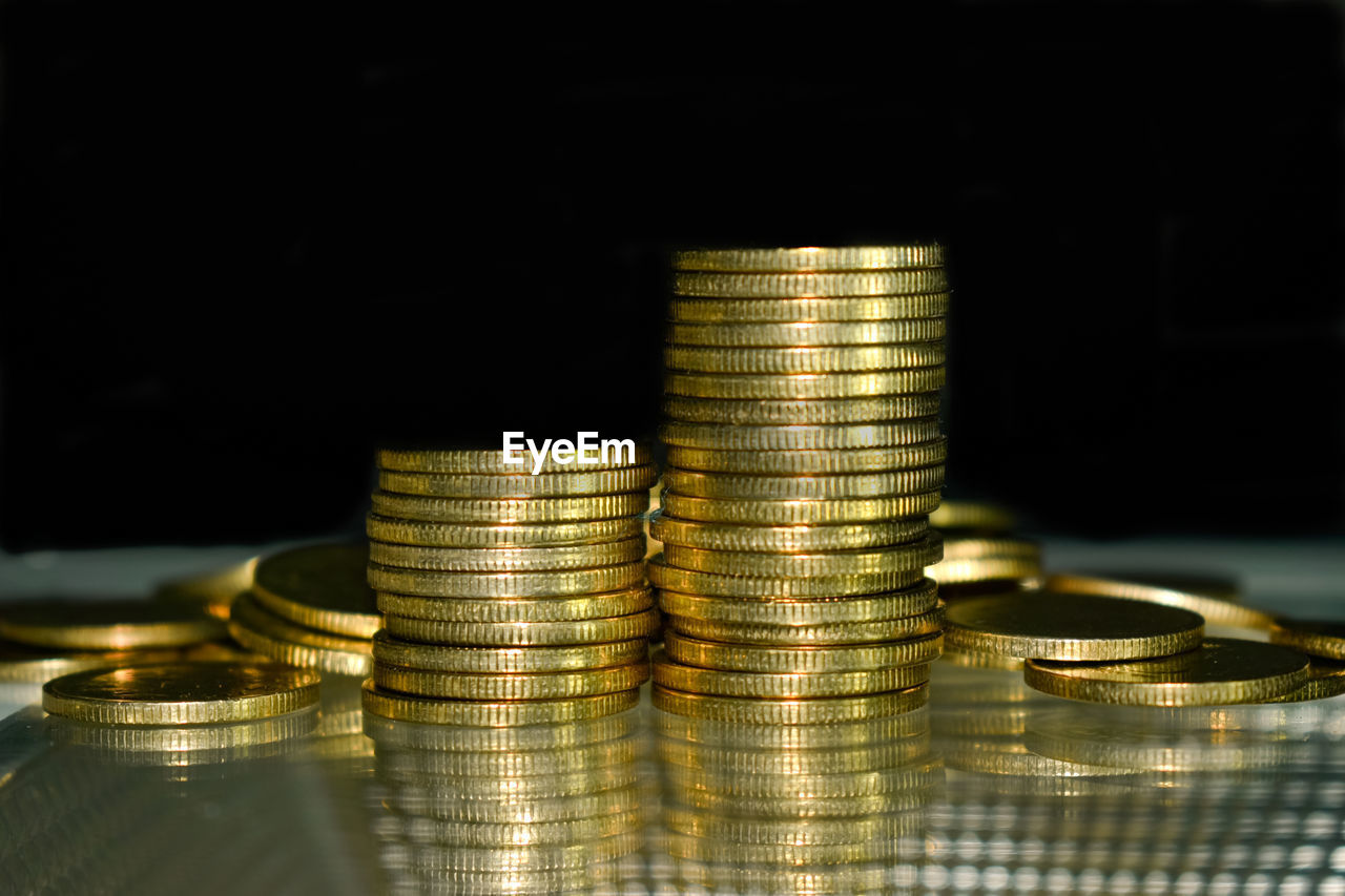 finance, coin, savings, wealth, currency, business, investment, money, gold, metal, money handling, banking, finance and economy, corporate business, economy, business finance and industry, large group of objects, success, paying, graph, exchange rate, debt, reflection, diagram, prosperity, home finances, yellow, shiny, indoors