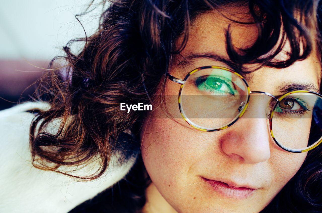 Close-up portrait of woman wearing eyeglasses