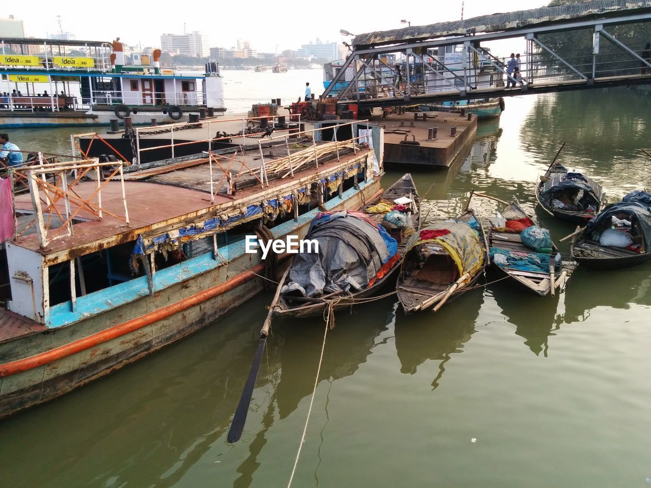 BOATS MOORED IN HARBOR