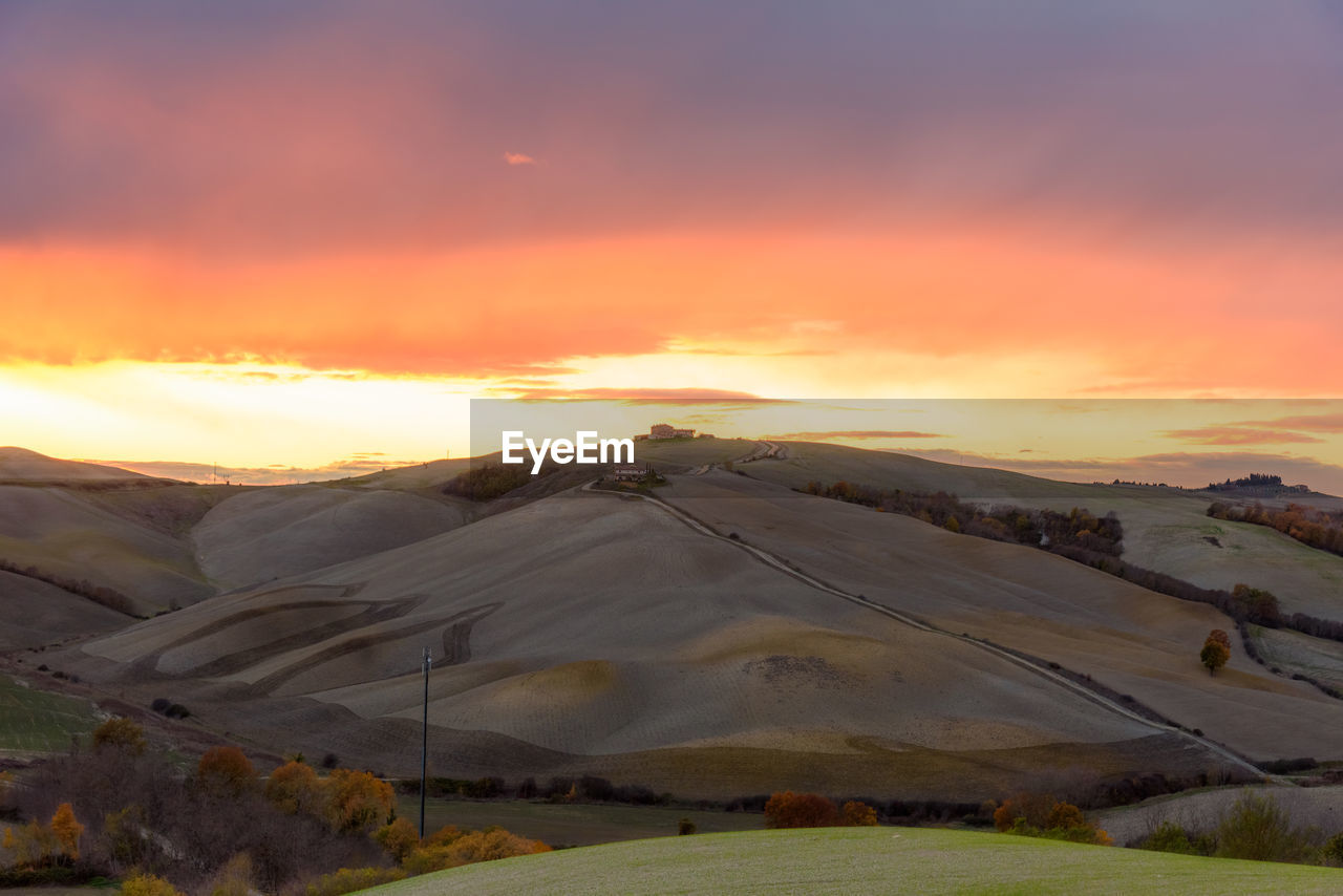 Scenic view of landscape against sky during sunset