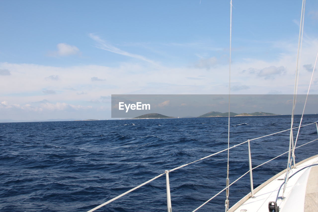 Scenic view of sea seen from sailboat against sky