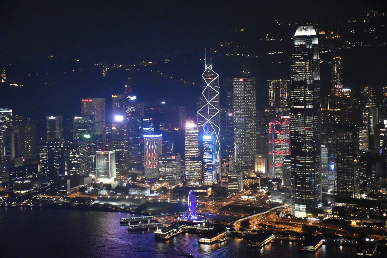 Aerial view of city lit up at night