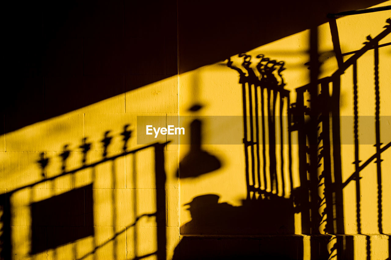 Shadow of gate on wall