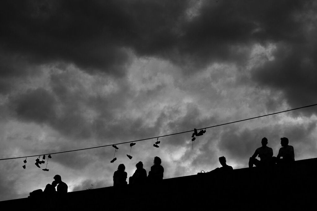 SILHOUETTE PEOPLE AGAINST CLOUDY SKY