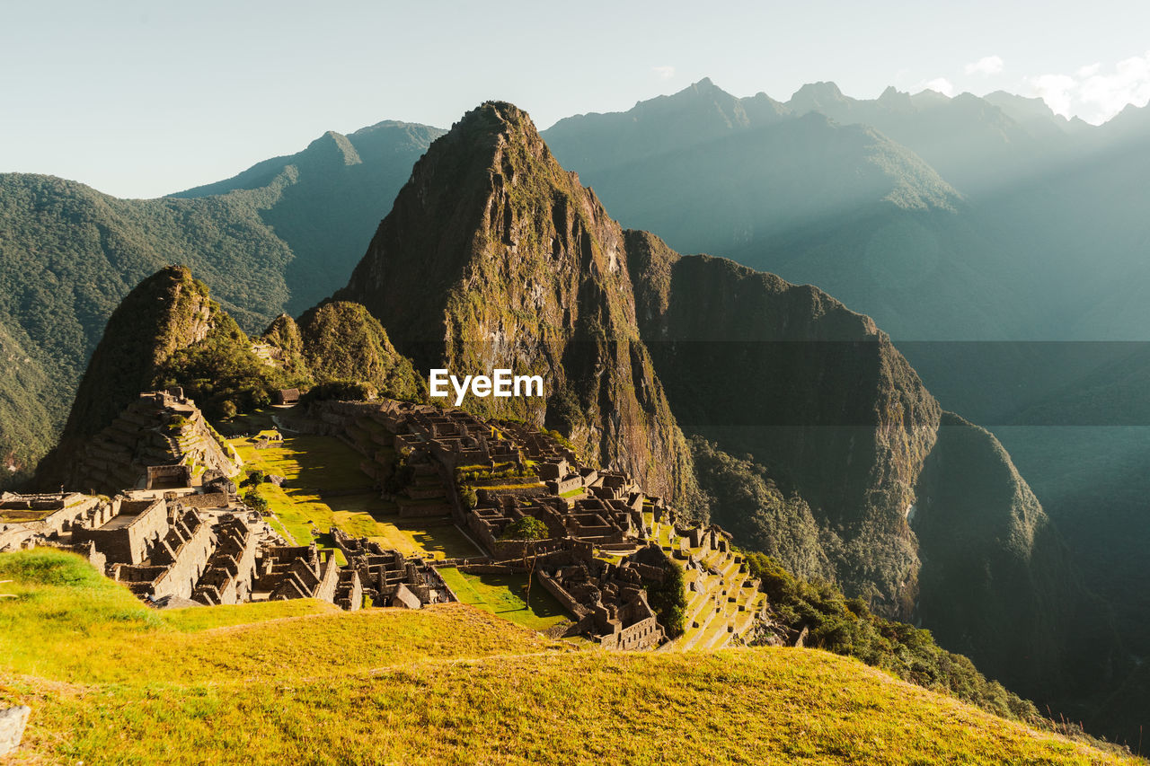 Machu picchu old inca ruins at sunrise in peru