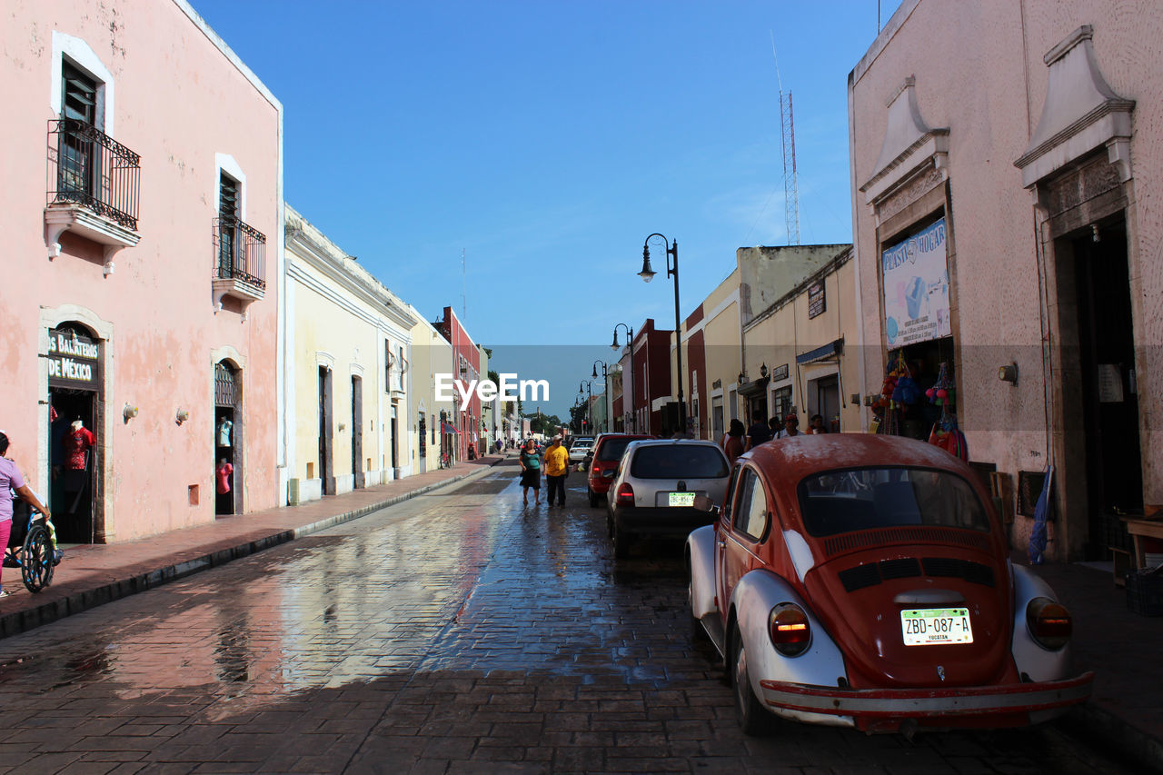 CARS ON ROAD IN CITY