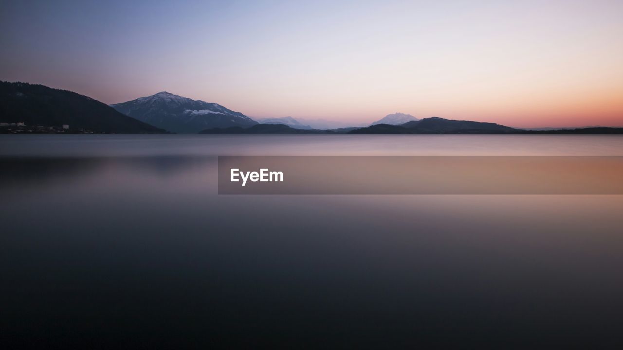 View of sea and mountains against sky