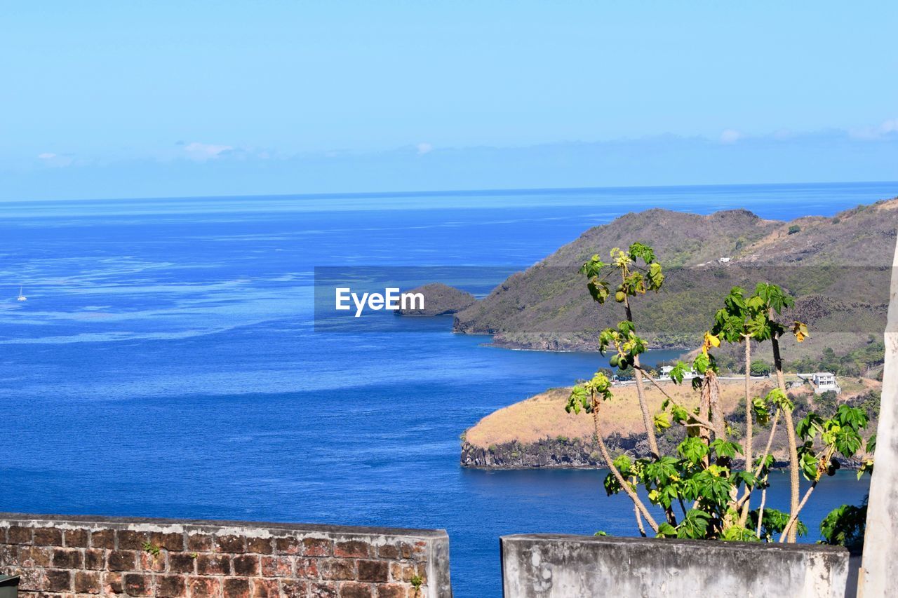 Scenic view of sea against blue sky