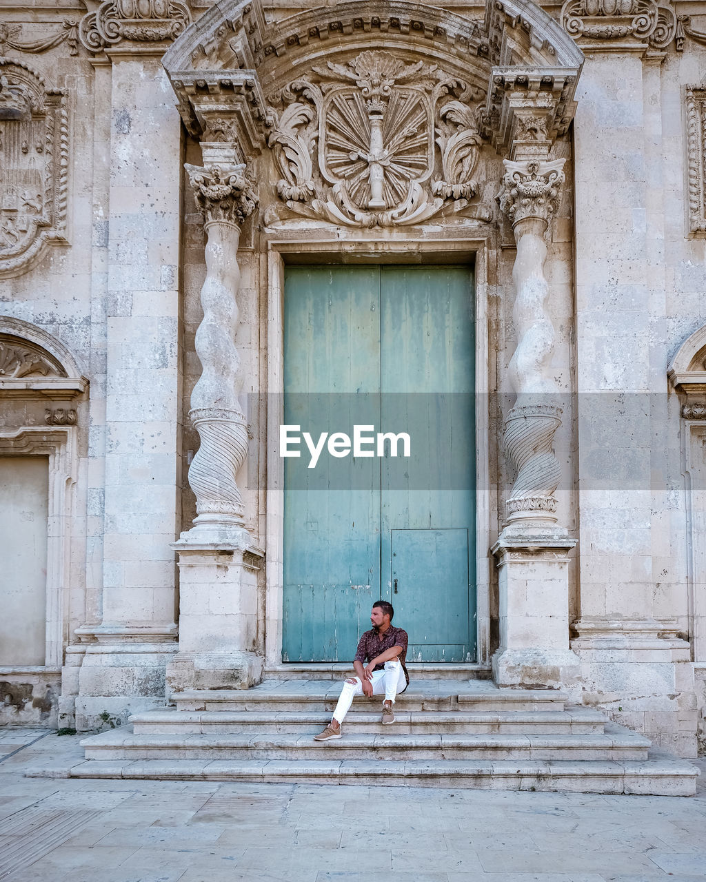 FULL LENGTH OF WOMAN STANDING OUTSIDE BUILDING