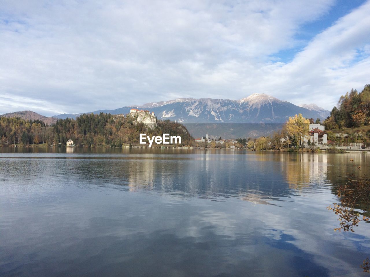 Scenic view of lake and mountains against sky