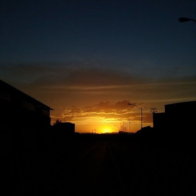 SILHOUETTE OF BUILDINGS AT SUNSET