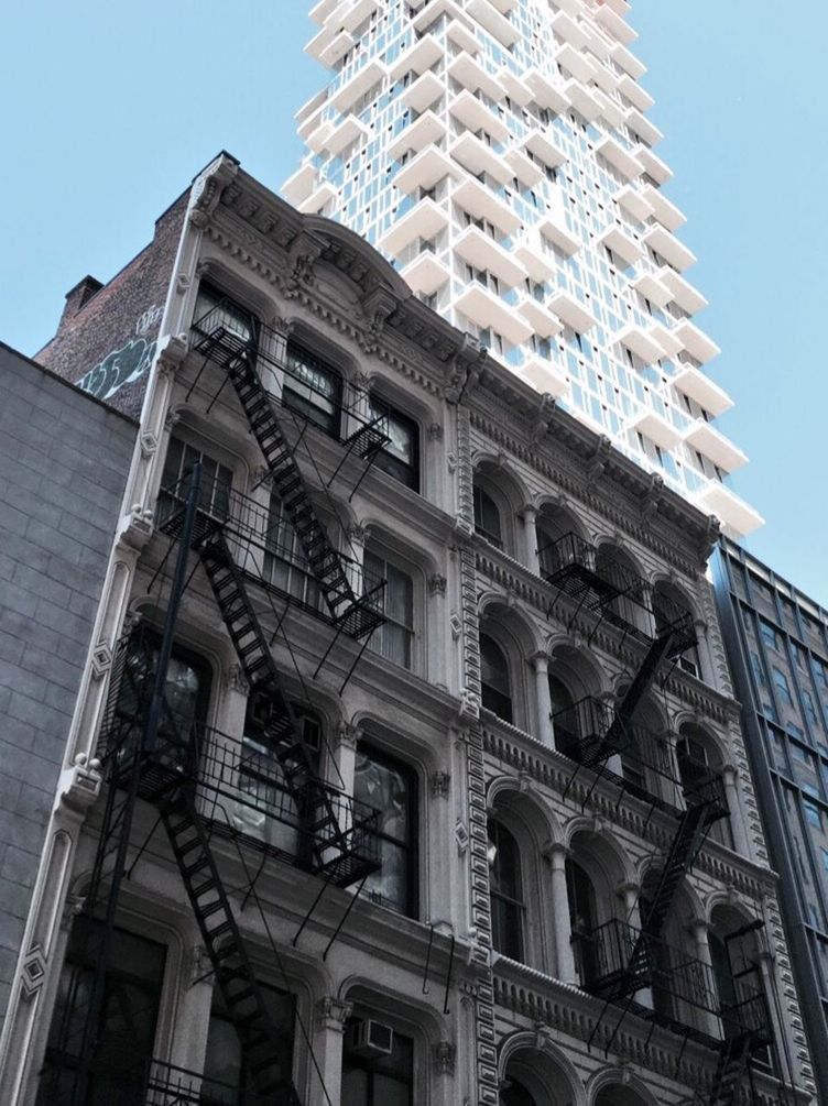 LOW ANGLE VIEW OF BUILDINGS IN CITY