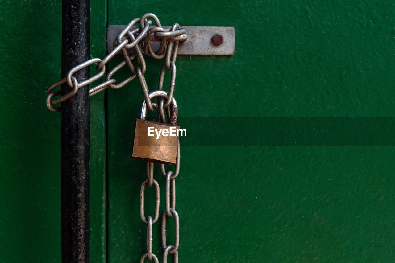 Close-up of padlock hanging on chain