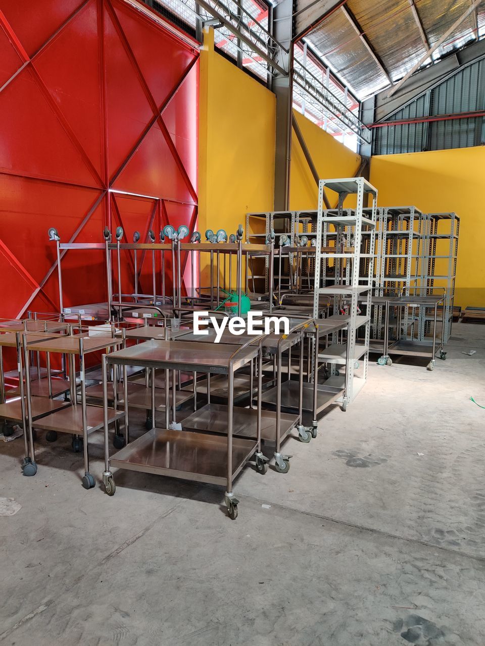 EMPTY CHAIRS AND TABLE IN FACTORY