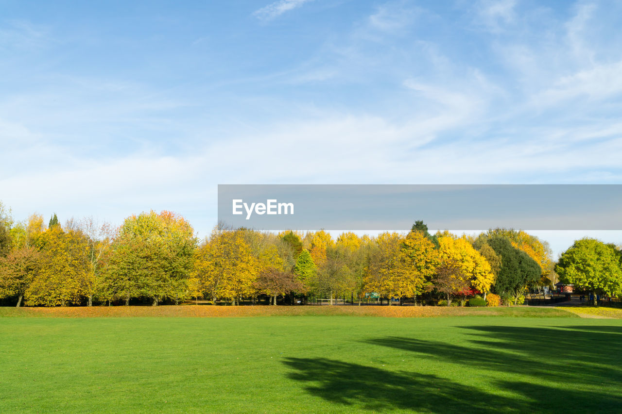 Scenic view of golf course against sky