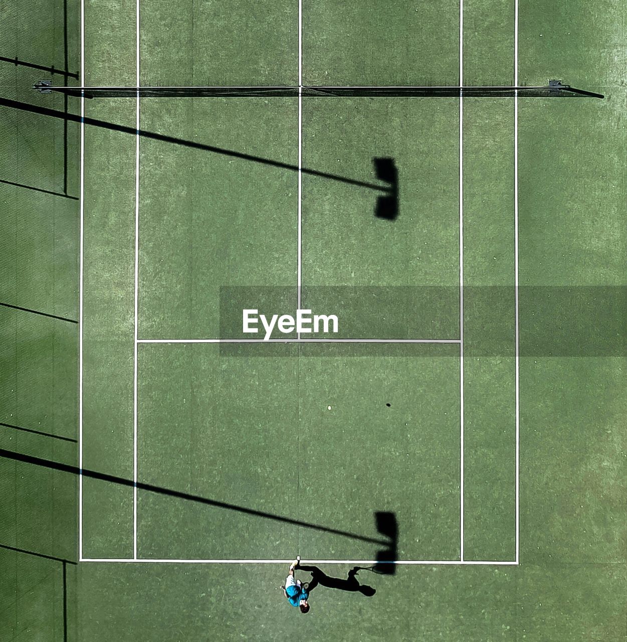 Directly above shot of athlete playing at tennis court