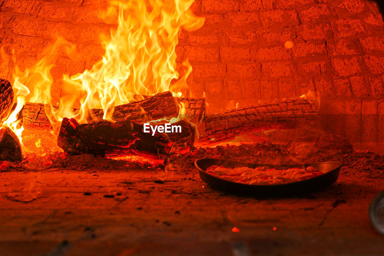 VIEW OF BURNING FIRE IN CONTAINER