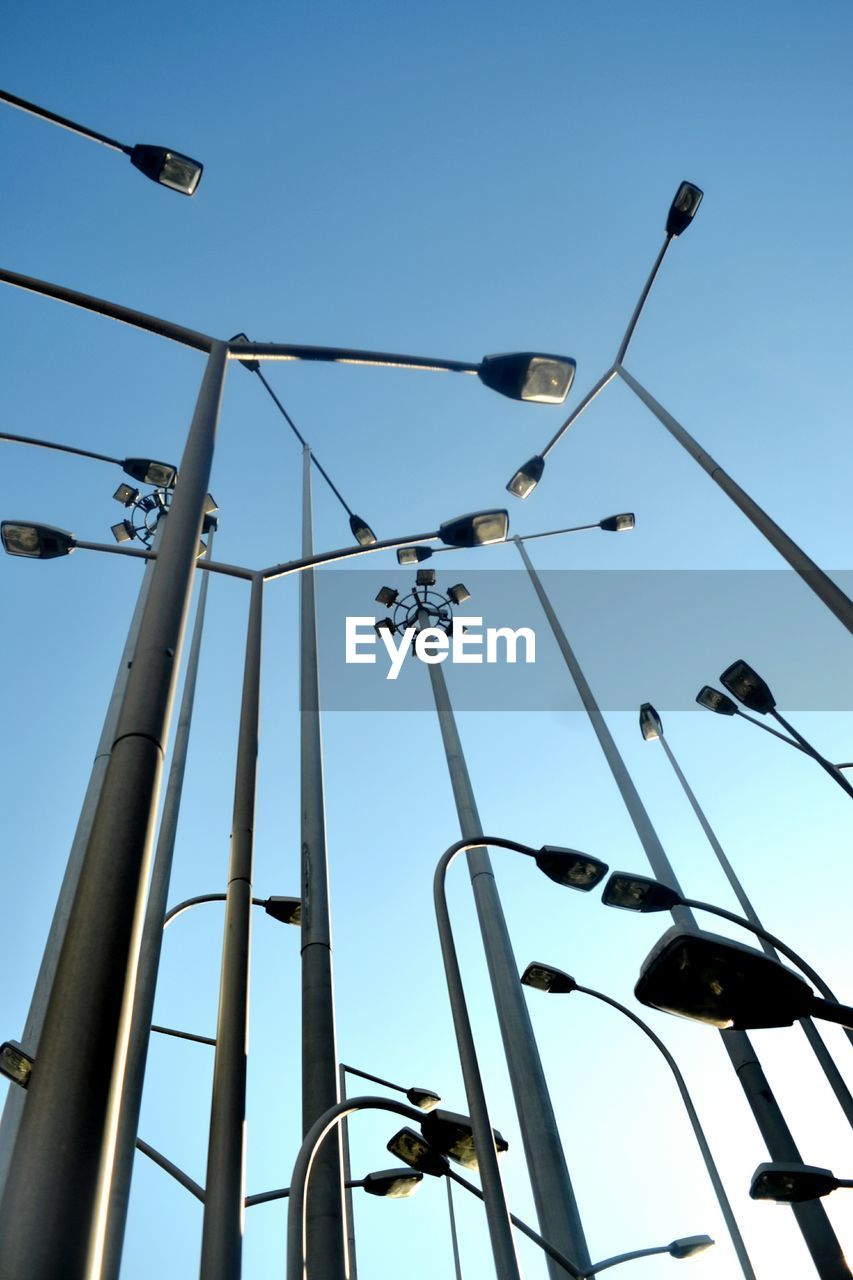 LOW ANGLE VIEW OF CABLES AGAINST BLUE SKY