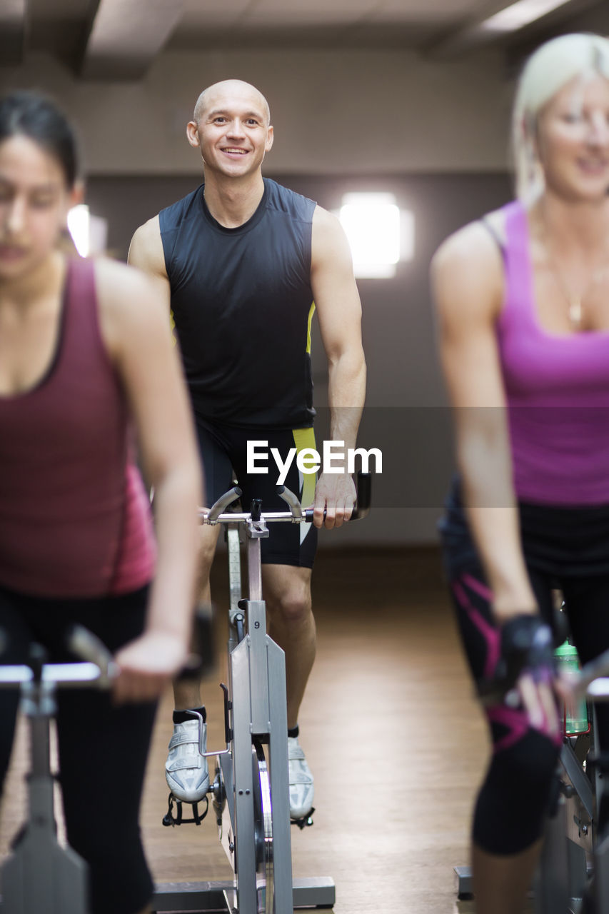 People training on exercising bikes