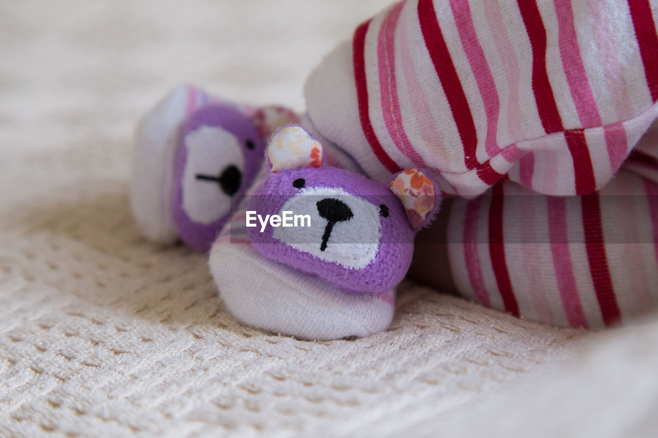 Close-up of baby wearing booties