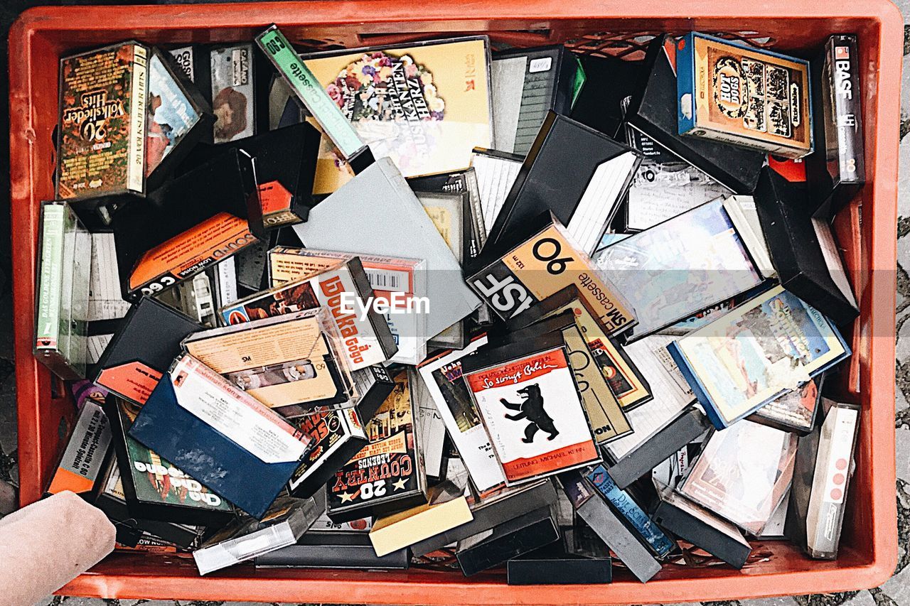 HIGH ANGLE VIEW OF BOOKS ON TABLE IN MARKET