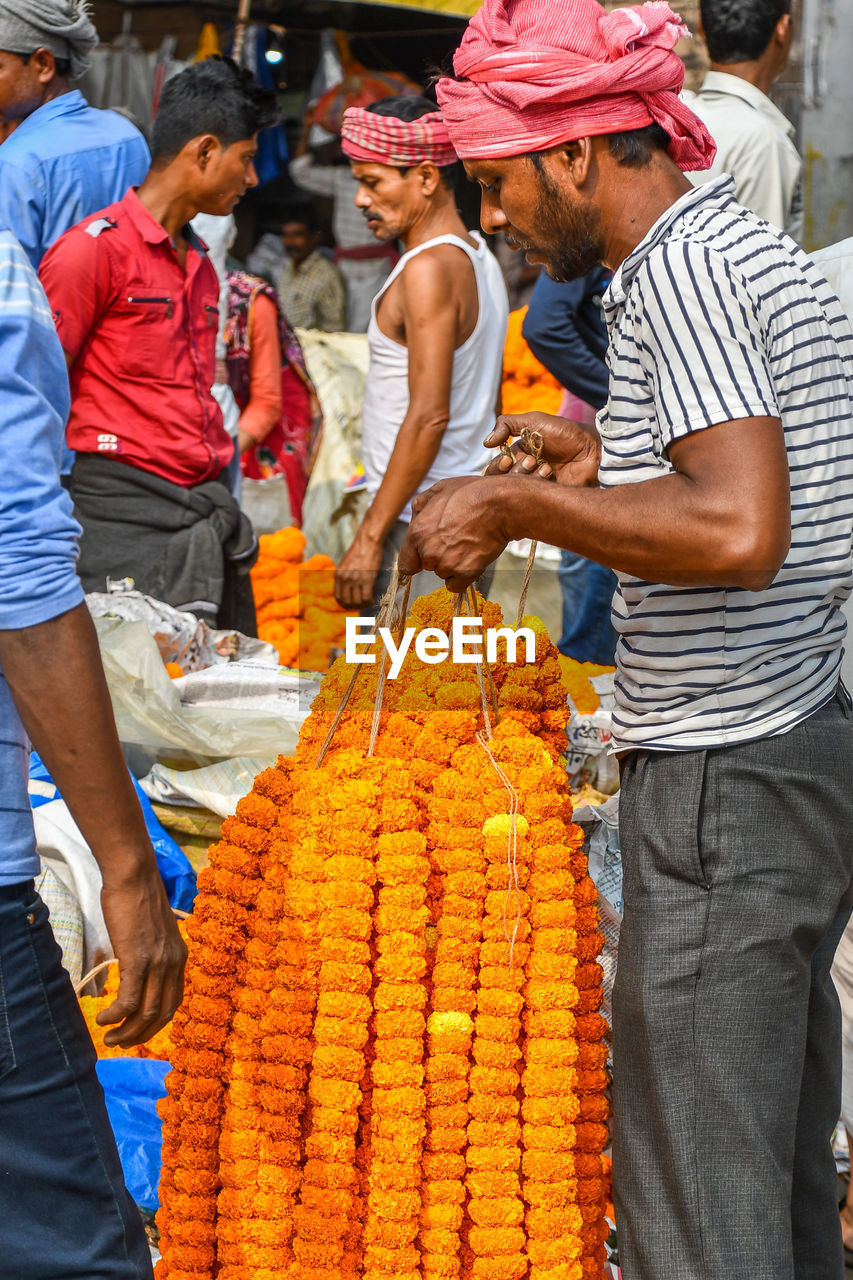 GROUP OF PEOPLE AT MARKET