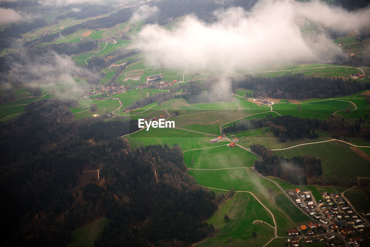 HIGH ANGLE VIEW OF SUNLIGHT FALLING ON LAND AGAINST SKY