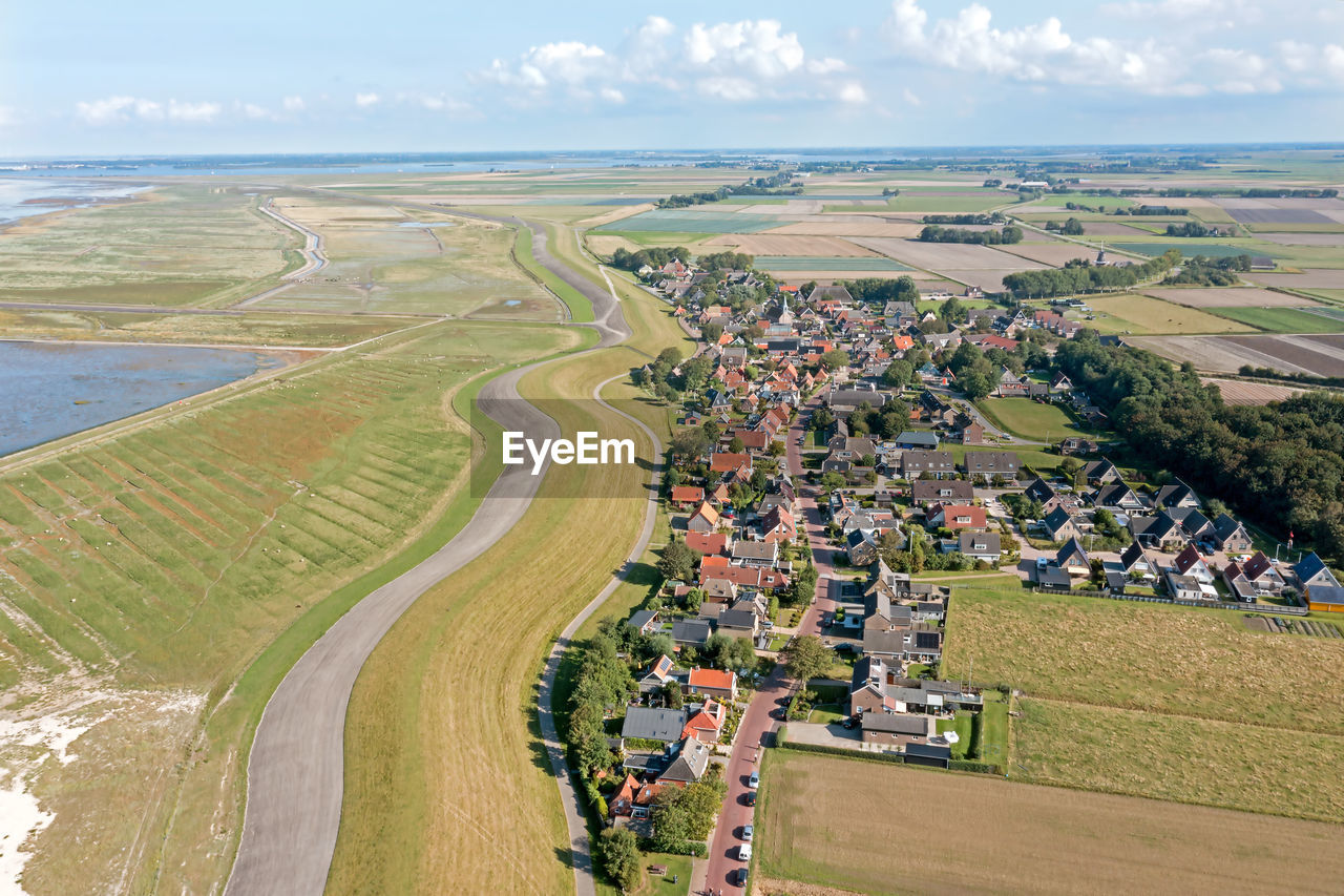 Aerial from the traditional village moddergat at the wadden sea in friesland the netherlands